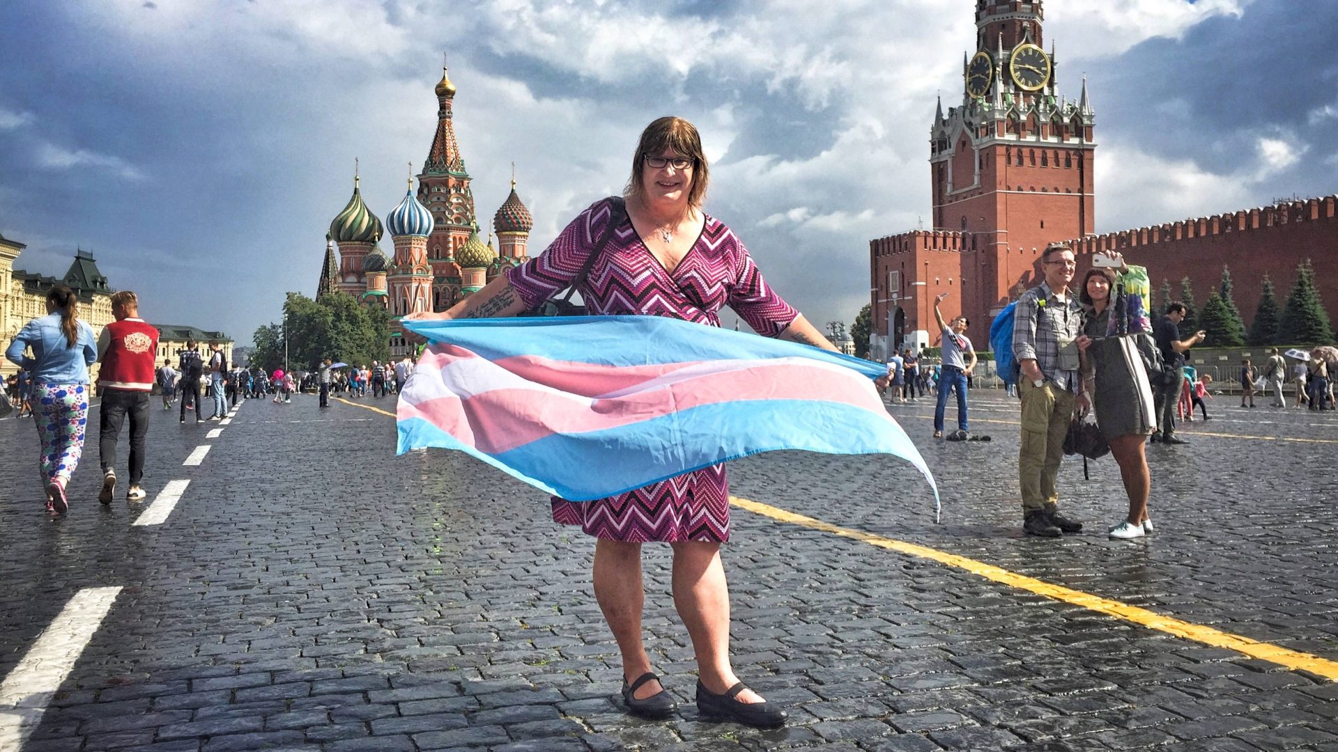 Sophie Cook holds a trans pride flag in Moscow's Red Square
